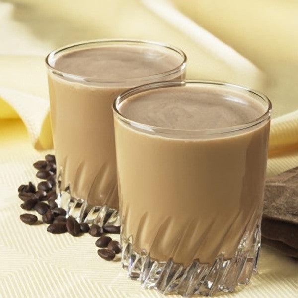 Two glasses of coffee-based drink with coffee beans on a light background